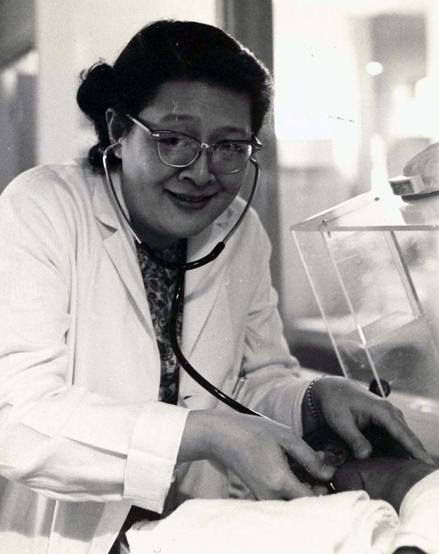 Pediatrician Florence Char, M.D. examining an infant at Arkansas Children's Hospital